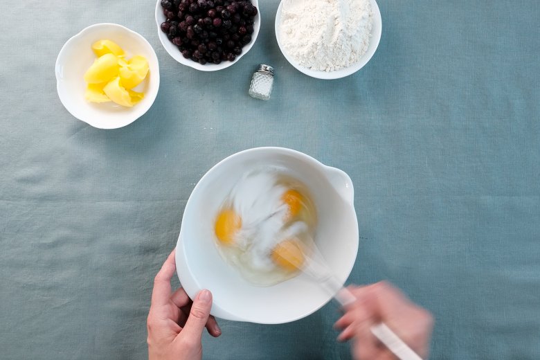 Whisk eggs and sugar together in a bowl.