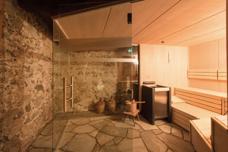 A contemporary riff on a historic structure: The dry-heat sauna in the basement is a wonderful place to relax and unwind. (Photo Credits: Hof Alpenjuwel)
