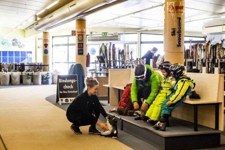 Getting ready for skiing with the kids at the Snow &amp; Fun Center Ski Rental in Serfaus