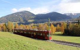 The Tram winds and turns and zigzags and goes through rolling green meadows on its way to Fulpmes in Stubaital Valley. Pictured in the rear is snow-flecked Patscherkofel, the iconic mountain in Innsbruck’s backyard. (Copyright: Haisjackl)