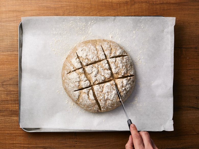 Step 10: Cut a pattern into the top of the bread using a knife.