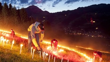 Over 50,000 torches are used to create a wide range of symbols and motifs at the Brixental Mountain Fire Festival, © Markus Mitterer / TVB Kitzbüheler Alpen-Brixental