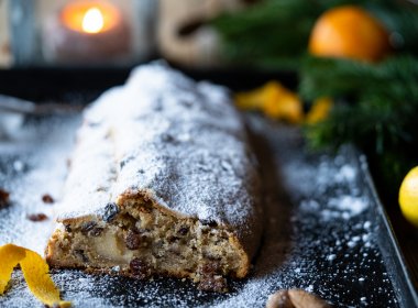 Cover the Stollen with melted clarified butter and finally add a thick layer of icing sugar.
