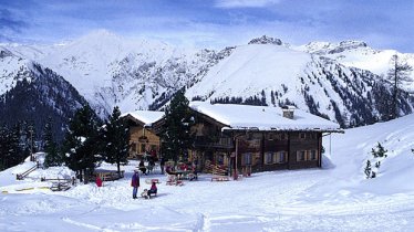 The Gieralm hut in front of the Hintertux glacier., © Grieralm