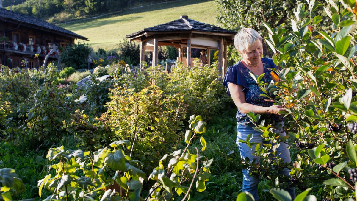 As a trained herb expert, the large herb garden is Regina Berger&rsquo;s pride and joy., © Tirol Werbung/Lisa Hörterer