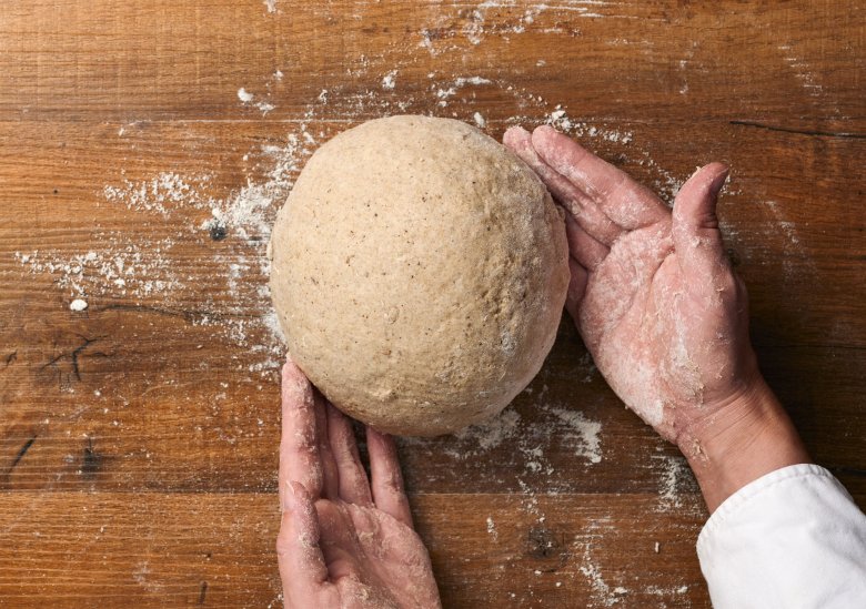 Step 5:&nbsp;Split the dough in half and shape each one into a ball.