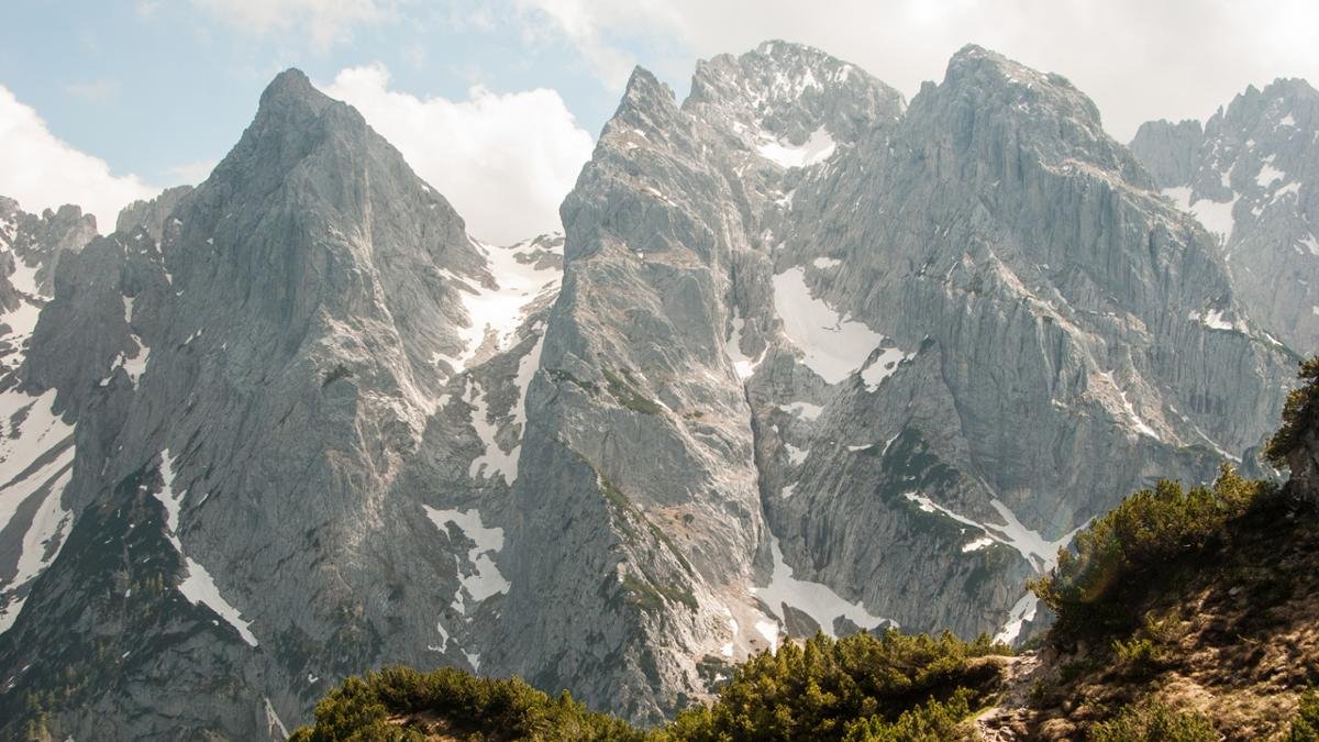 Fleischbank, Predigtstuhl and Totenkirchl are three of the most famous mountains in the region. Hire a mountain guide and follow in the footsteps of famous climbers as you conquer all six major peaks in the Wilder Kaiser to complete the "Kaiser Hoch 6"., © Jannis Braun